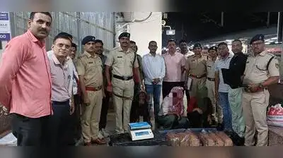 Sniffer dog Veeru along with 'ganja' that was seized and accused arrested by the Railway