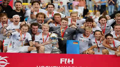 (AP Photo/Geert Vanden Wijngaert) Gold medal winners, Germany, celebrate with the trophy
