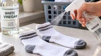 Spraying it directly onto the socks themselves before they go in, rather than adding extra