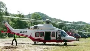 Boy waves T-shirt for help, climbs onto helicopter in dramatic rescue — Nepal floods