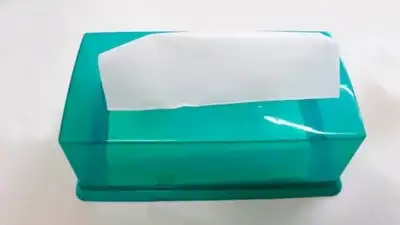 Rather than buying a dedicated bag dispenser or a fabric holder, an empty box you were going