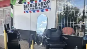 A San Antonio storm knocked out power and damaged homes; one barber simply moved his chair outside