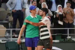 FILE - Winner Spain's Carlos Alcaraz, right, and Italy's Jannik Sinner hug after the final