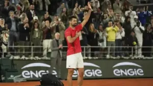 Novak Djokovic applauds the French Open crowd after his loss to Jannik Sinner in the semi-final
