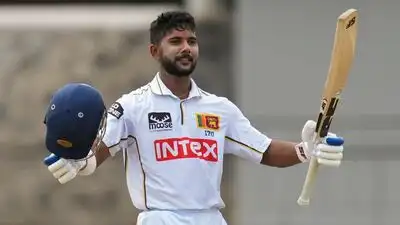 Sri Lanka's Sonal Dinusha celebrates his century on the fourth day of the second Test cricket