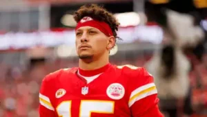 Kansas City Chiefs quarterback Patrick Mahomes argues his surgically repaired left knee