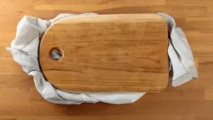 The tiny kitchen trick that makes chopping safer — Put a towel under your cutting board
