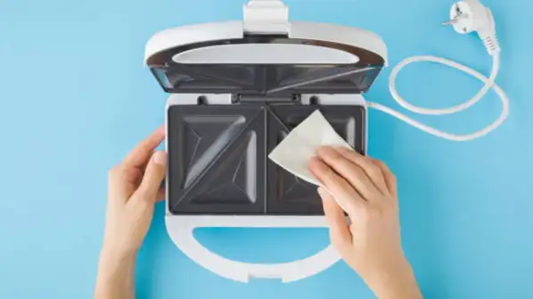 But what exactly happens when you do this, and is it a safe way to clean your sandwich maker?