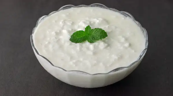 If you stir it, the curd may look strangely glossy and feel slimy, not thick, creamy and smooth