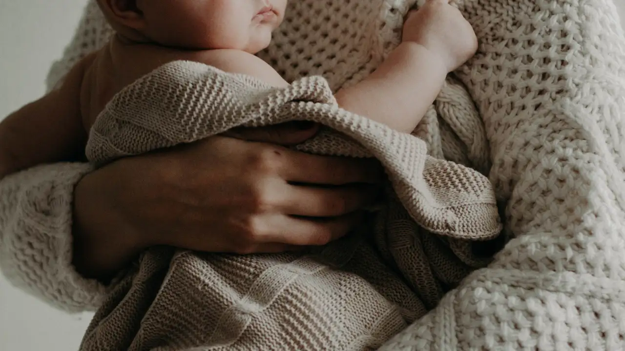 27 In the clip, a father uses a long, low-pitched “Om” sound while holding his crying baby — 28
