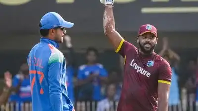 West Indies John Campbell, right, celebrates his century during the second One Day