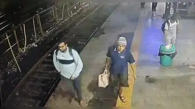 Spotted: CCTV footage of Bhopal railway station captures Parveez Dharwad (left),34,Wednesday
