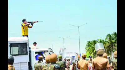 Raja, 46, an armed reserve policeman who was photographed with a gun atop a police vehicle