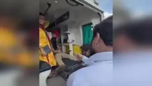 A screen grab of a video that shows Shinde rushing to assist the cop who collapsed during duty
