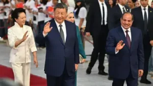 Chinese President Xi Jinping, second left, and his wife Peng Liyuan, left, are welcomed