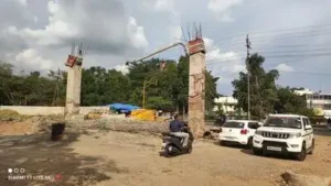 Bare pillars stand at the entrance of GMC Miraj after an under-construction concrete arch