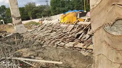 Bare pillars stand at the entrance of GMC Miraj after an under-construction concrete arch