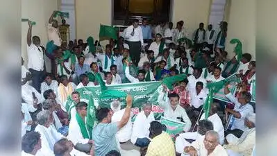 Farmers stage a dharna at CADA office in Mysuru on Monday urging the govt to release water