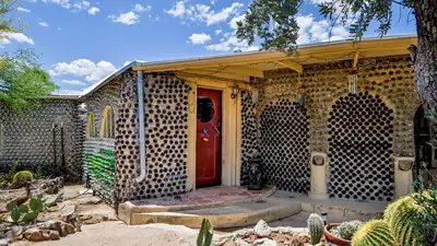 In 1964, an Arizona couple began building a carport with discarded bottles; years later