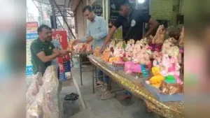 A devotee selecting Ganesh idol from a shop in Raja Bazar area of Chhatrapati Sambhajinagar