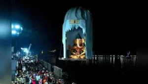 A Ganesh idol being immersed in Hussainsagar early on Saturday