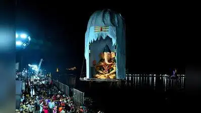 A Ganesh idol being immersed in Hussainsagar early on Saturday