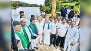 Minister T Raghumurthy (3rd from L) along with MLAs after inaugurating a pilot project Sunday