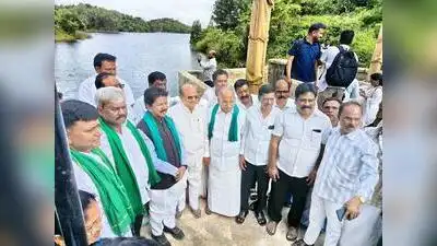 Minister T Raghumurthy (3rd from L) along with MLAs after inaugurating a pilot project Sunday