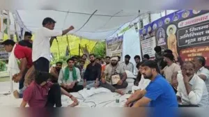 He was removed by the Police in the early hours of Friday Ravi Gautam holding the portrait