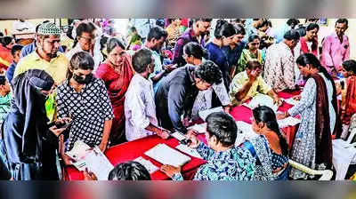 Voters wait to submit documents after receiving notices for Special Intensive Revision (SIR)