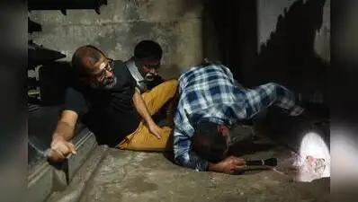 Officials examine the drainage tunnel at Ramappa Temple