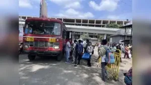 Passengers line up to board a bus at Pune’s Swargate depot