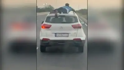 Cop foils smugglers' attempt to escape by clinging on to their SUV for nearly 40km