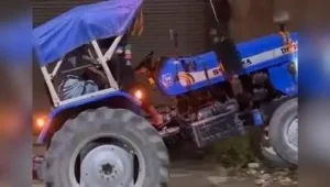 Tractor driver allegedly performed a dangerous stunt by lifting the vehicle onto two wheels