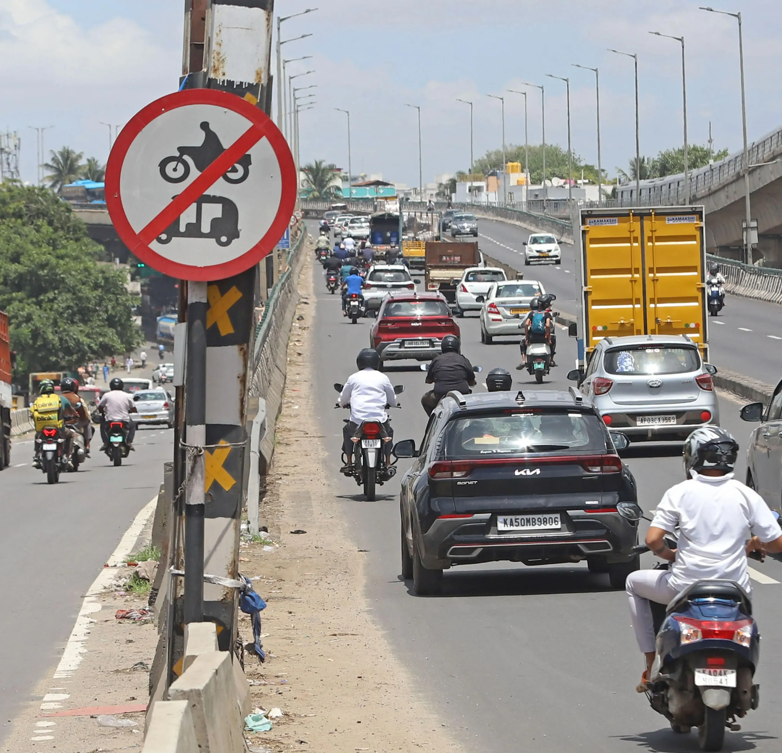 Two wheelers take the express way flyover on Airport road as restriction relaxed a bit