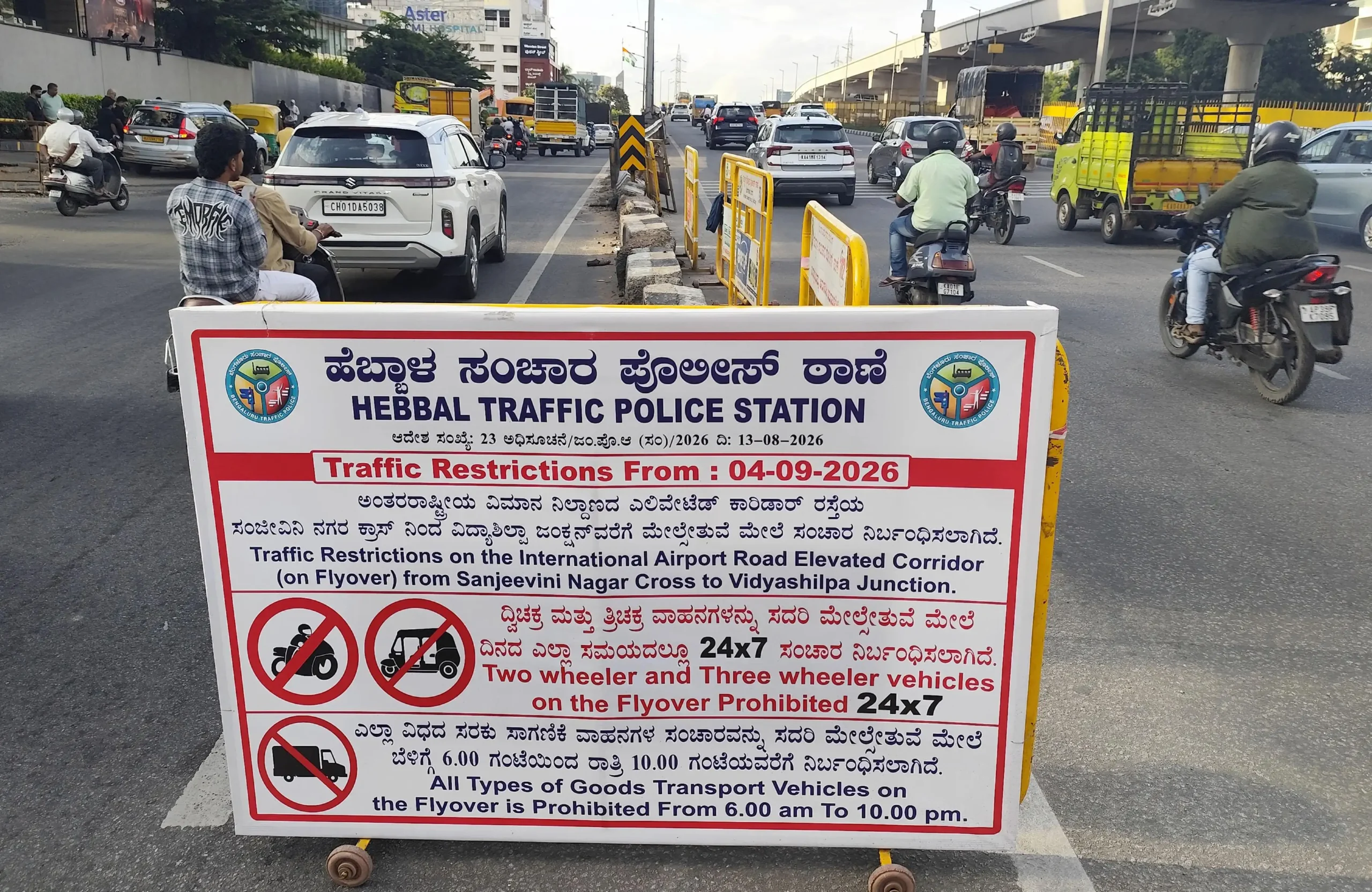 Two wheelers take the express way flyover on Airport road as restriction relaxed a bit