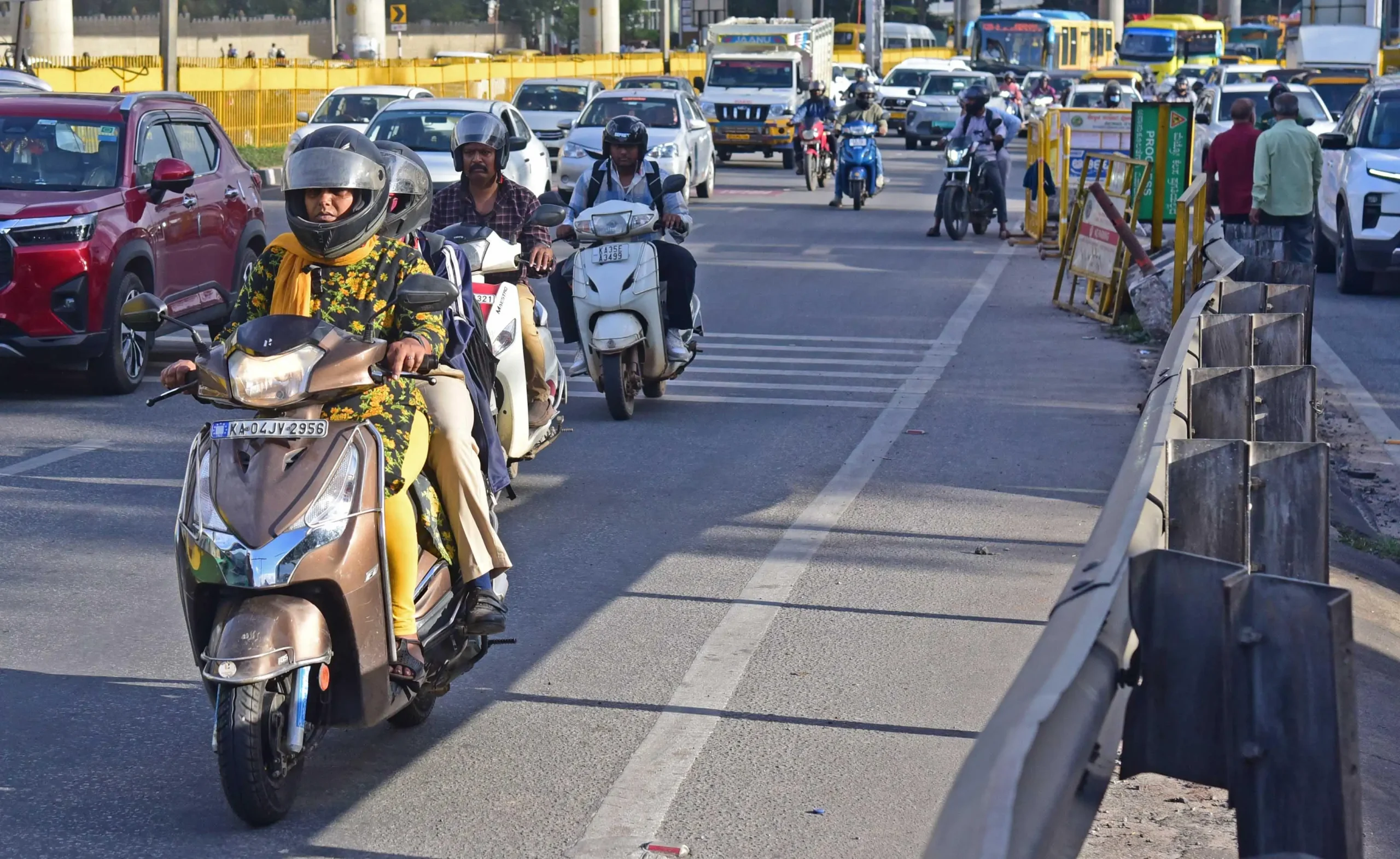 Two wheelers take the express way flyover on Airport road as restriction relaxed a bit