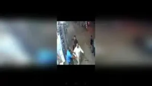 A man who had stepped in to settle a family dispute was attacked with a machete in full public