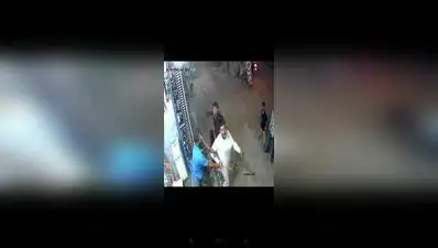 A man who had stepped in to settle a family dispute was attacked with a machete in full public