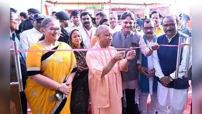 Chief minister Yogi Adityanath cuts the ribbon to inaugurate the registration of plots