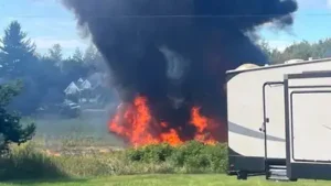 Smoke rises after an F-16 fighter jet crashed in a rural area near Traverse City (AP photo)