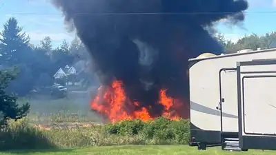 Smoke rises after an F-16 fighter jet crashed in a rural area near Traverse City (AP photo)