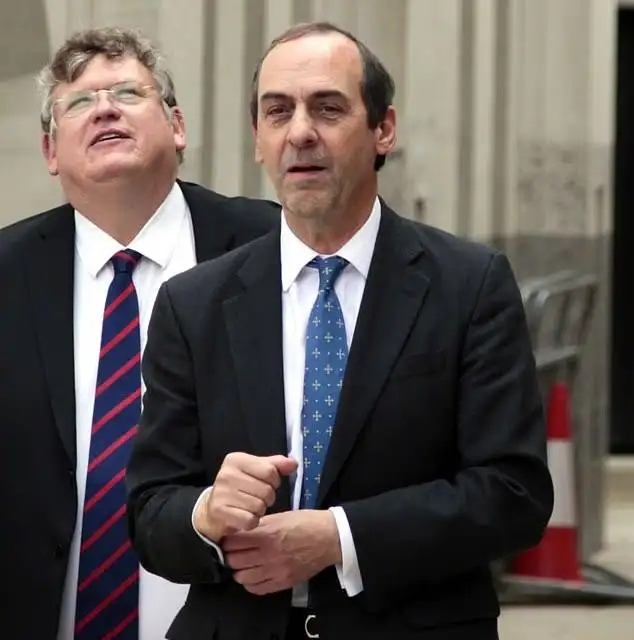 Parliament bell ringer Adrian Udal tore out a gate at his banker neighbour’s £2 million Fulham