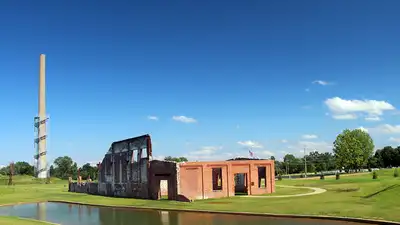 What was once an industrial site dominated by a glass factory and a towering smokestack has