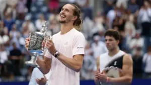 Alexander Zverev poses with the trophy after he won the men's singles final of the US Open