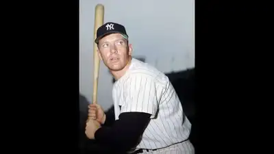 A couple found a rare Mickey Mantle photo inside a baseball book at a garage sale; it later sold