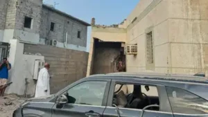 Damaged building and vehicle after Houthi attack in Jazan, Saudi Arabia, on the southern border