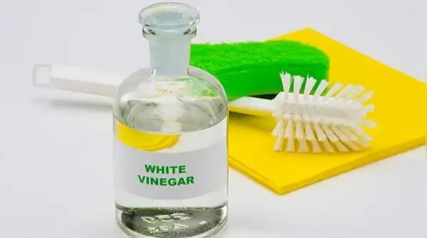 If your water's particularly hard, a light vinegar mist sprayed on after each shower helps keep
