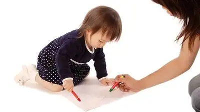 Right around her first birthday, picking up something tiny between her thumb and forefinger is