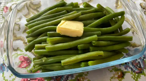Few combinations are as effortlessly comforting as green beans, butter and garlic